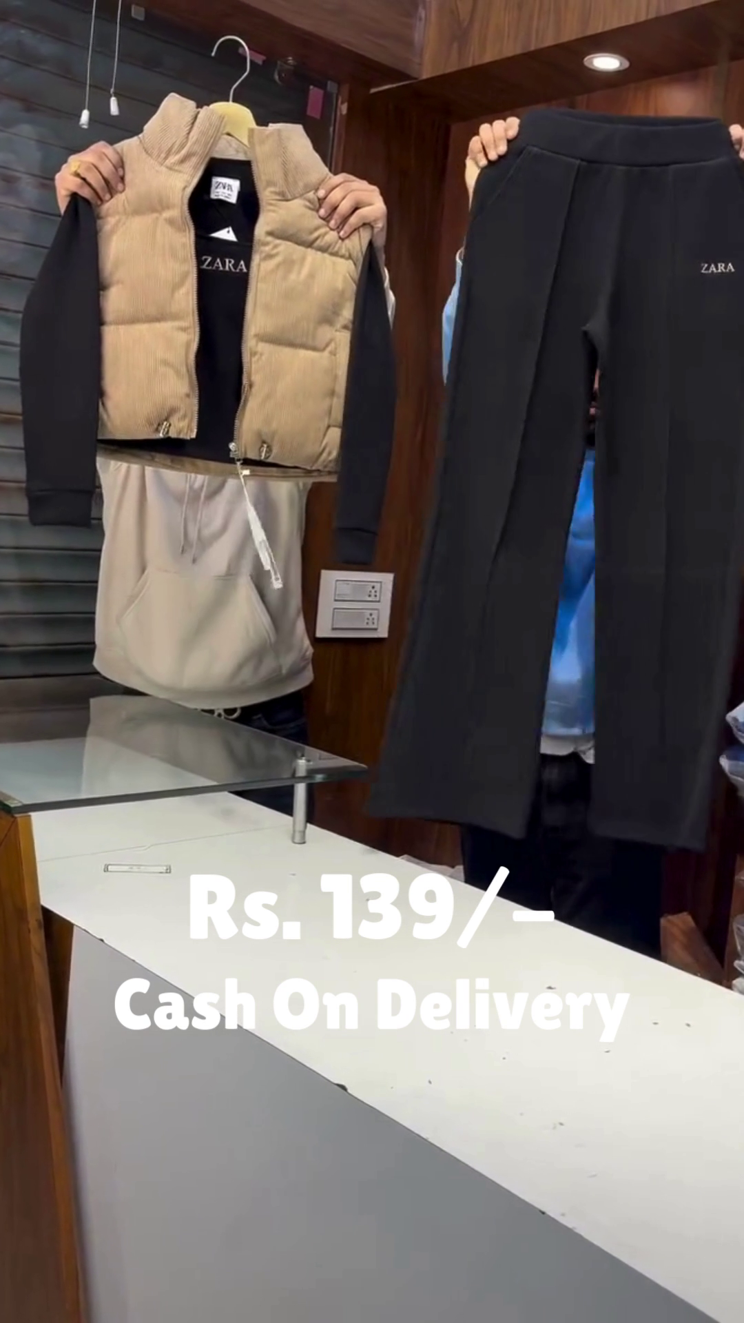 “Layered Ember II: Puffer Vest Over Hoodie with Monochrome Motion” 🧥🖤🤎