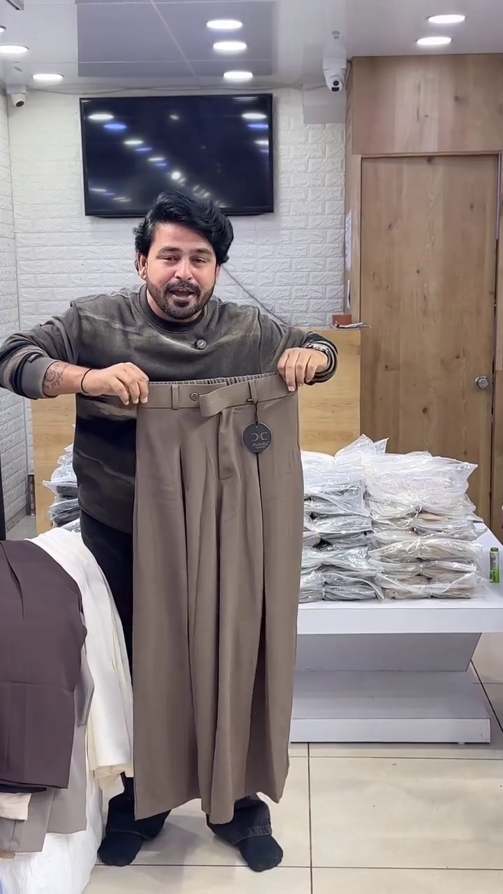 “Earthbound Elegance: Brown Pleated Trousers of Roots, Rhythm & Refined Ease 🌾👖✨”