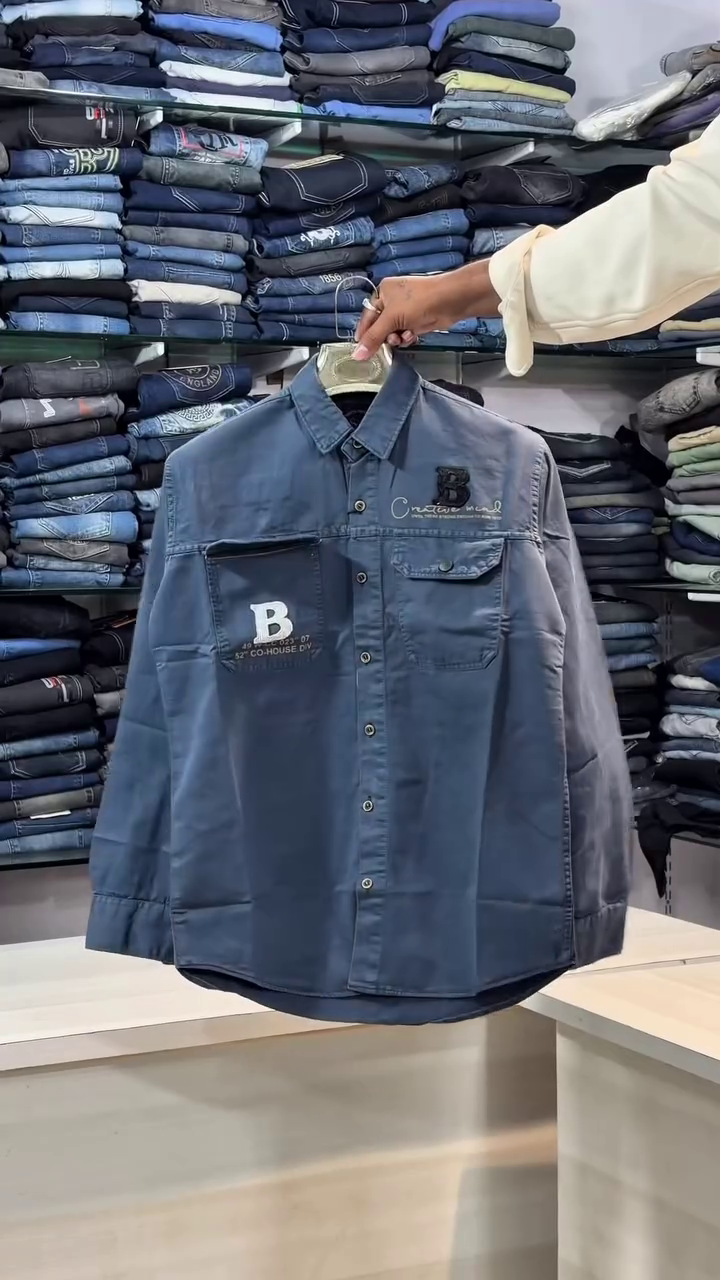 Light Blue Denim Shirt 💙👕 with Dual Chest Pockets 📦 White & Black Lettering 🅱️ Creative Print ✨ and Button-Down Closure ⚪139