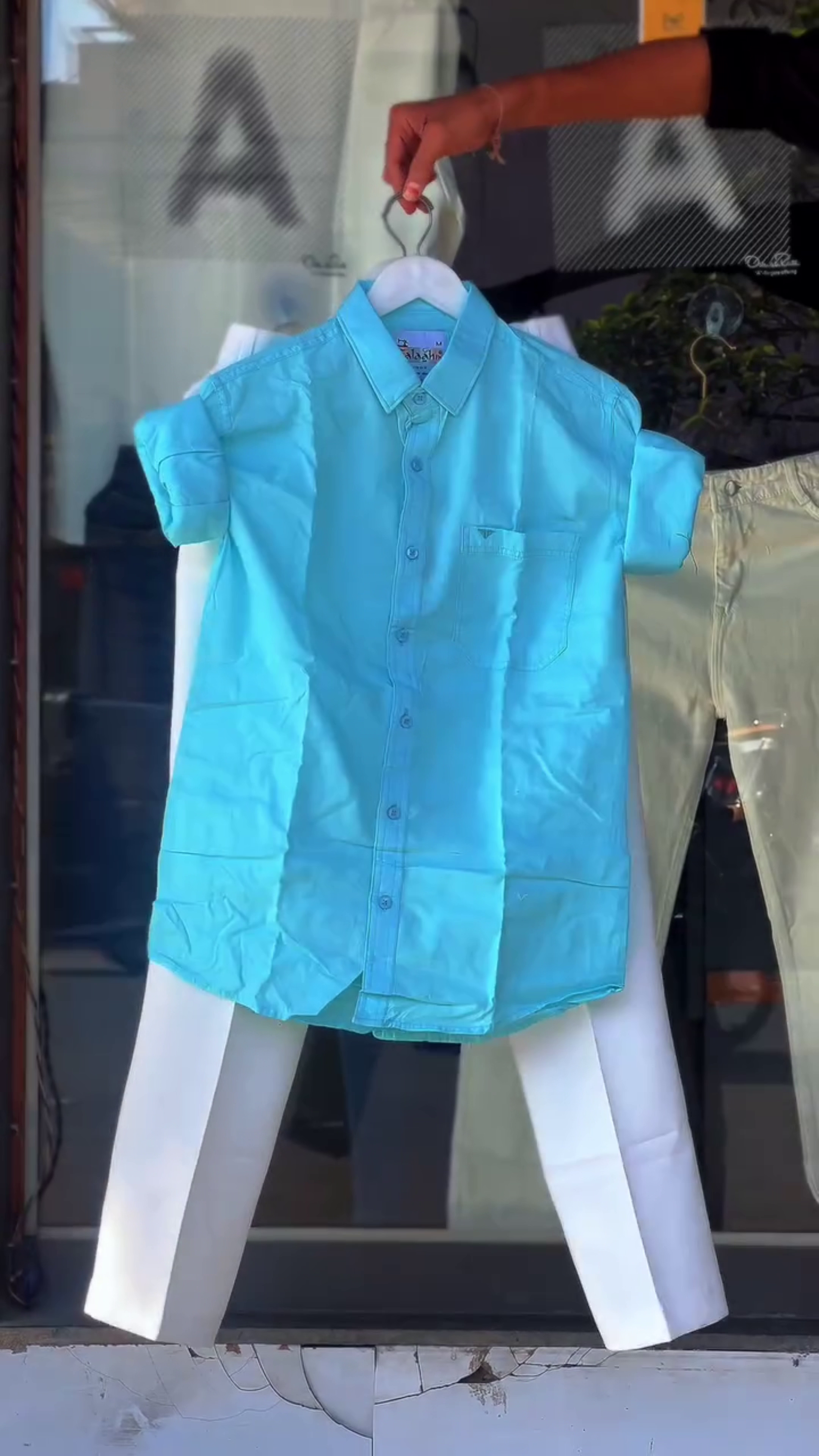 Green Short-Sleeved Button-Up Shirt 💚👕 with White Embroidered Logo ✨ Paired with White Pants 🤍👖