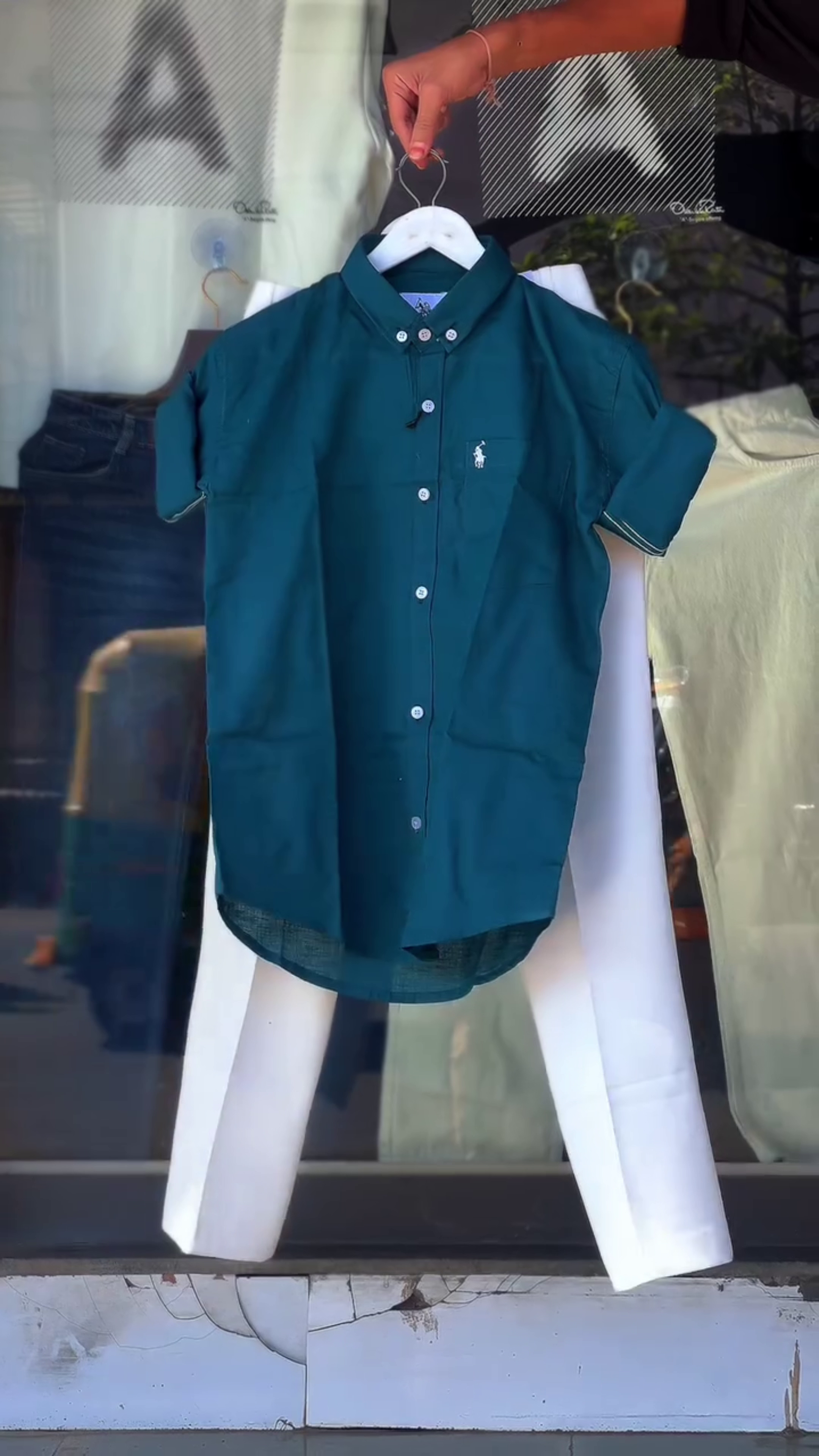 Green Short-Sleeved Button-Up Shirt 💚👕 with White Embroidered Logo ✨ Paired with White Pants 🤍👖