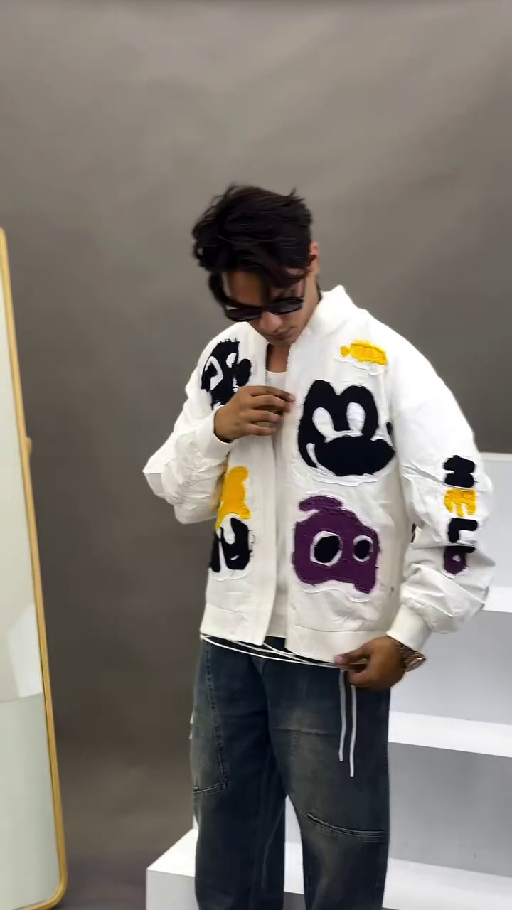 White Artistic Jacket 🤍🎨 with Abstract Colorful Patches 💛💜🖤 Zipper Front ✨ and Dark Denim Jeans 👖