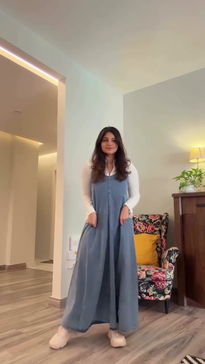 Blue Denim Long Dress 💙👗 Layered Over White Long-Sleeve Top 🤍👕 with Casual White Sneakers 👟 Cozy Modern Styling ✨