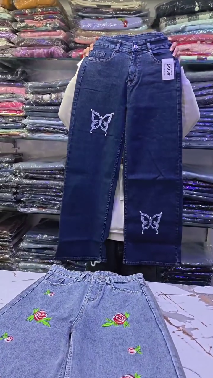 Light Blue Denim Jeans 💙👖 with Vertical White Butterfly Designs 🦋✨ Five-Pocket Style 📦 and Button Closure ⚪