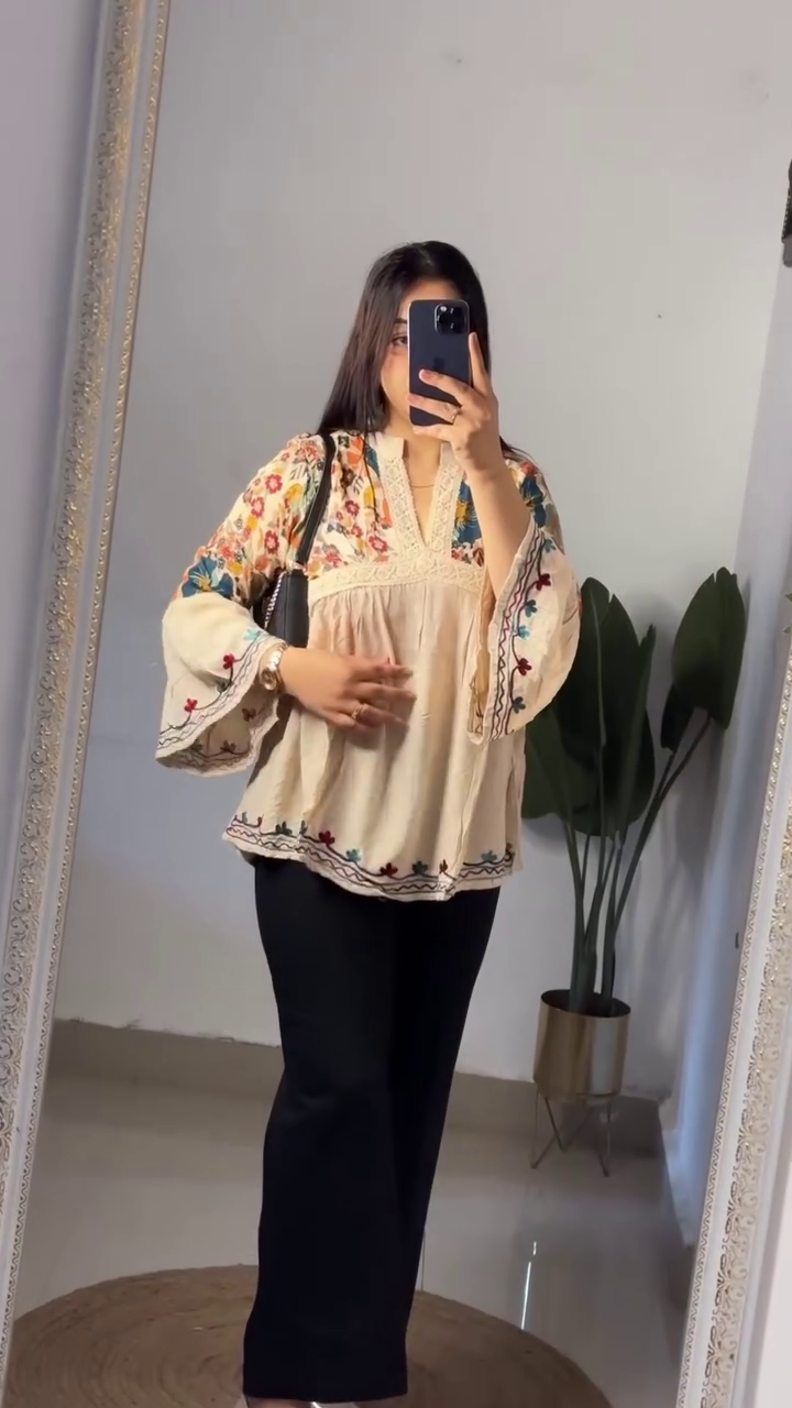 Elegant Bohemian Embroidered Black Flared Sleeve Tunic Top with Beige Tailored Wide-Leg Trousers, Structured Mini Shoulder Bag & Glossy Nude Pointed Heels Set