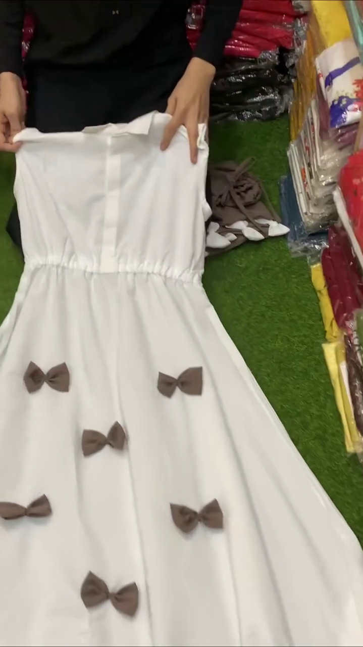 Brown Cropped Drawstring Blouson Top with Full-Length Sleeves Paired with Cream A-Line Flowy Skirt Featuring 3D Bow Appliqué Detail Co-Ord Set